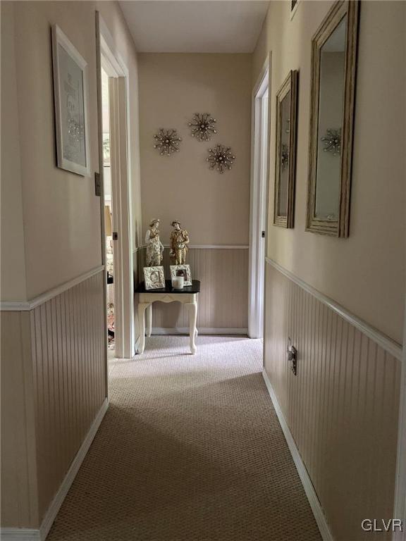 142 Colette Lane Dingmans Ferry, PA 18328 - Photo 10 of 14 a view of a hallway with wooden floor and a cabinet