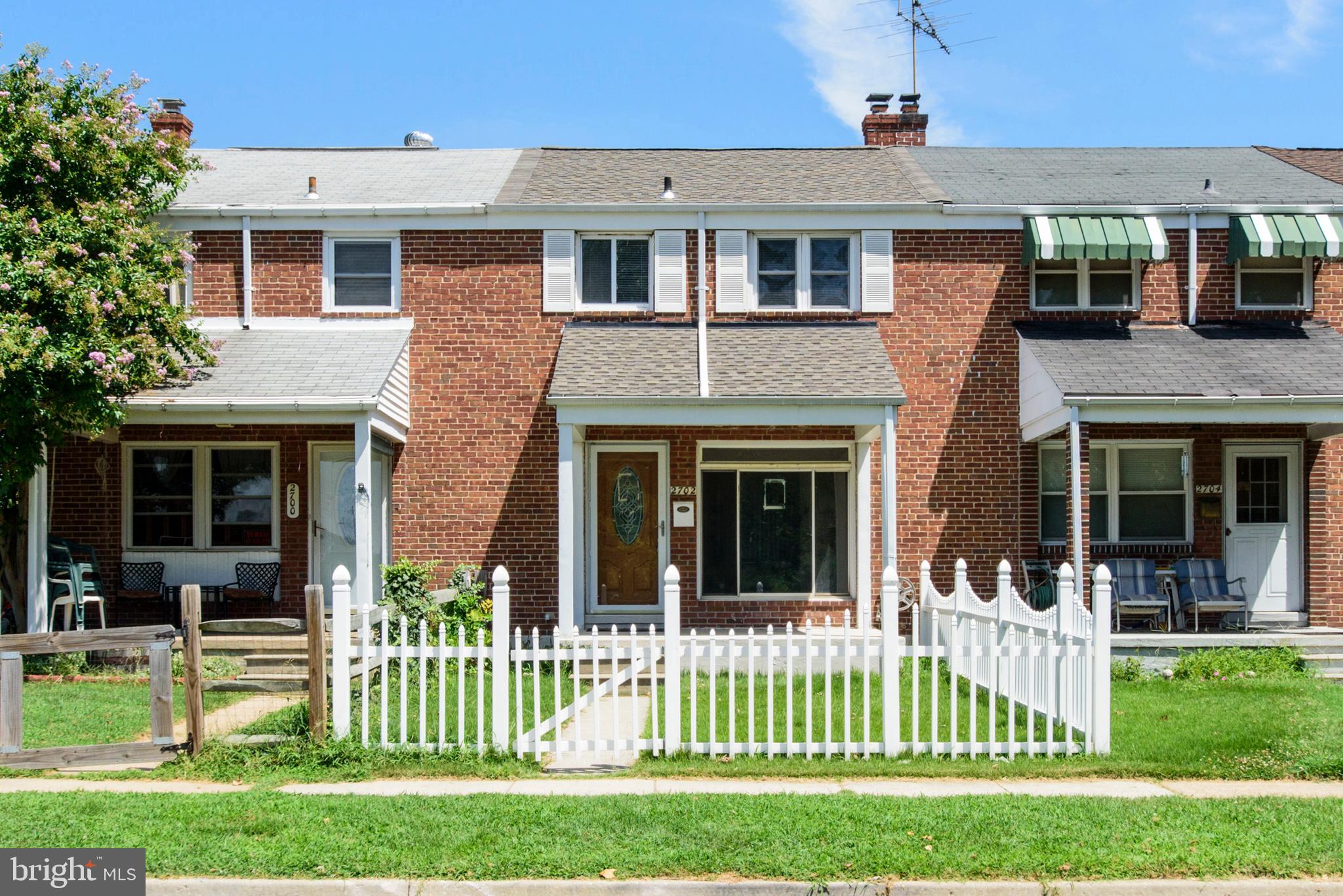 2702 Kirkleigh Road Baltimore, MD 21222 - Photo 1 of 32 a front view of a house with a yard