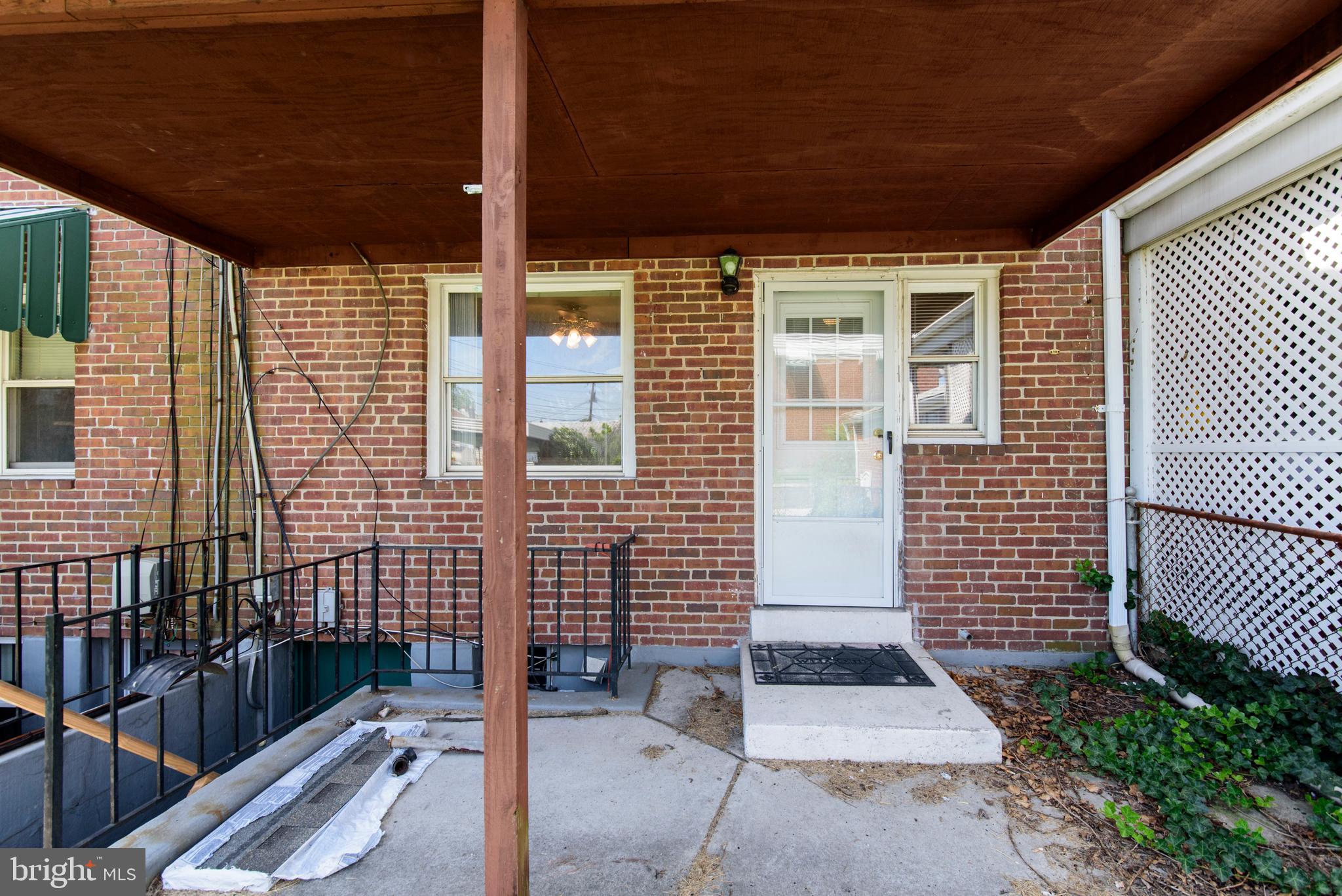 2702 Kirkleigh Road Baltimore, MD 21222 - Photo 23 of 32 a view of house with wooden floor and wooden fence