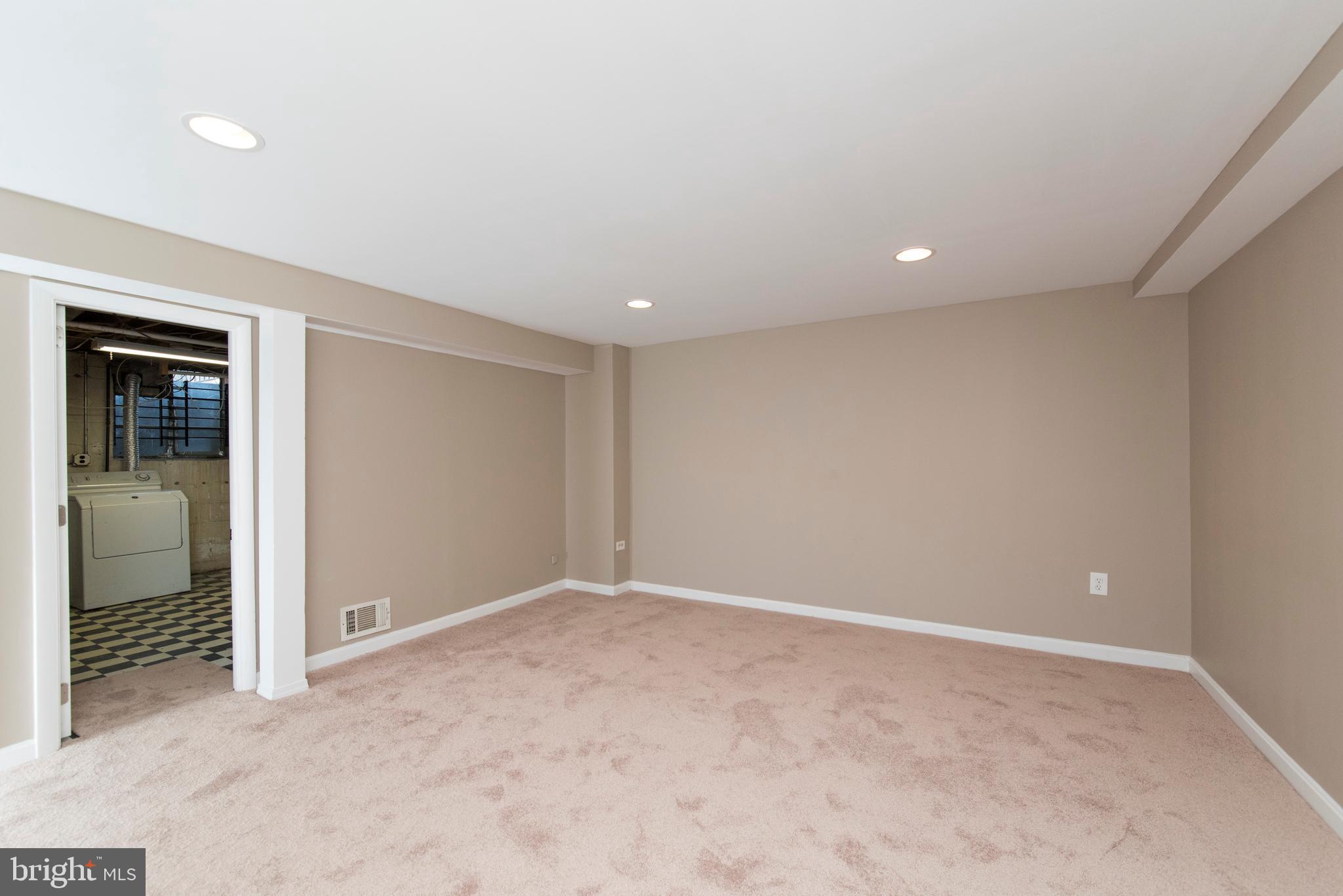 2702 Kirkleigh Road Baltimore, MD 21222 - Photo 26 of 32 an empty room with closet and a window