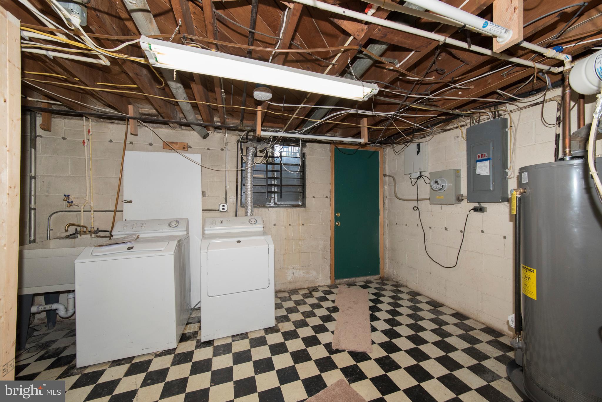 2702 Kirkleigh Road Baltimore, MD 21222 - Photo 29 of 32 a bathroom with a shower toilet and a sink