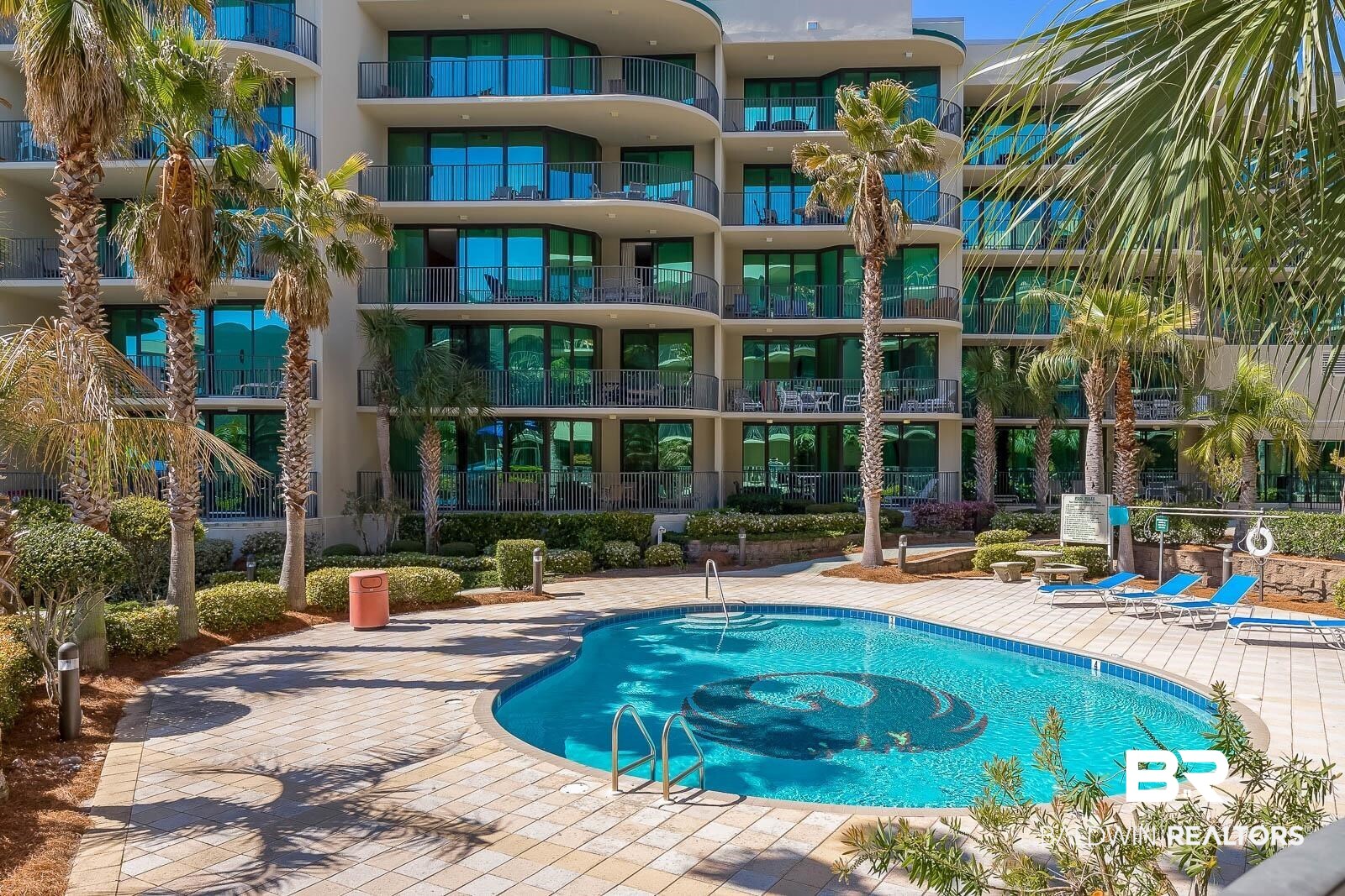 27580 Canal Road, Unit 1429 Orange Beach, AL 36561 - Photo 38 of 45 Community pool with a patio