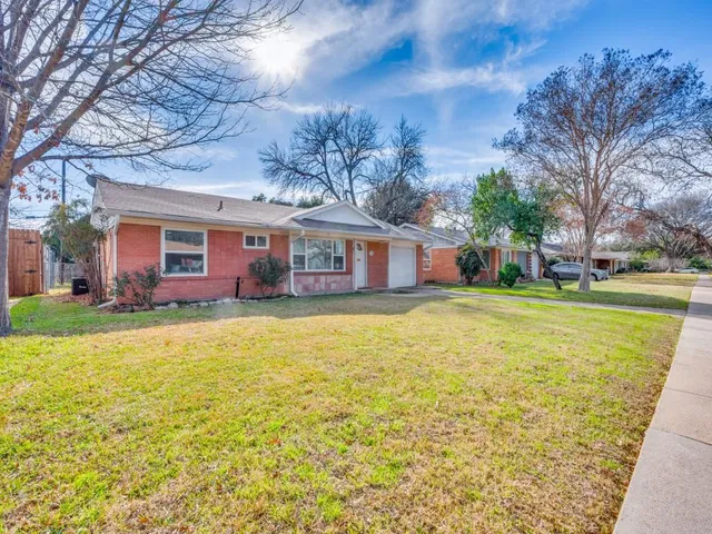 a house view with swimming pool in front of it