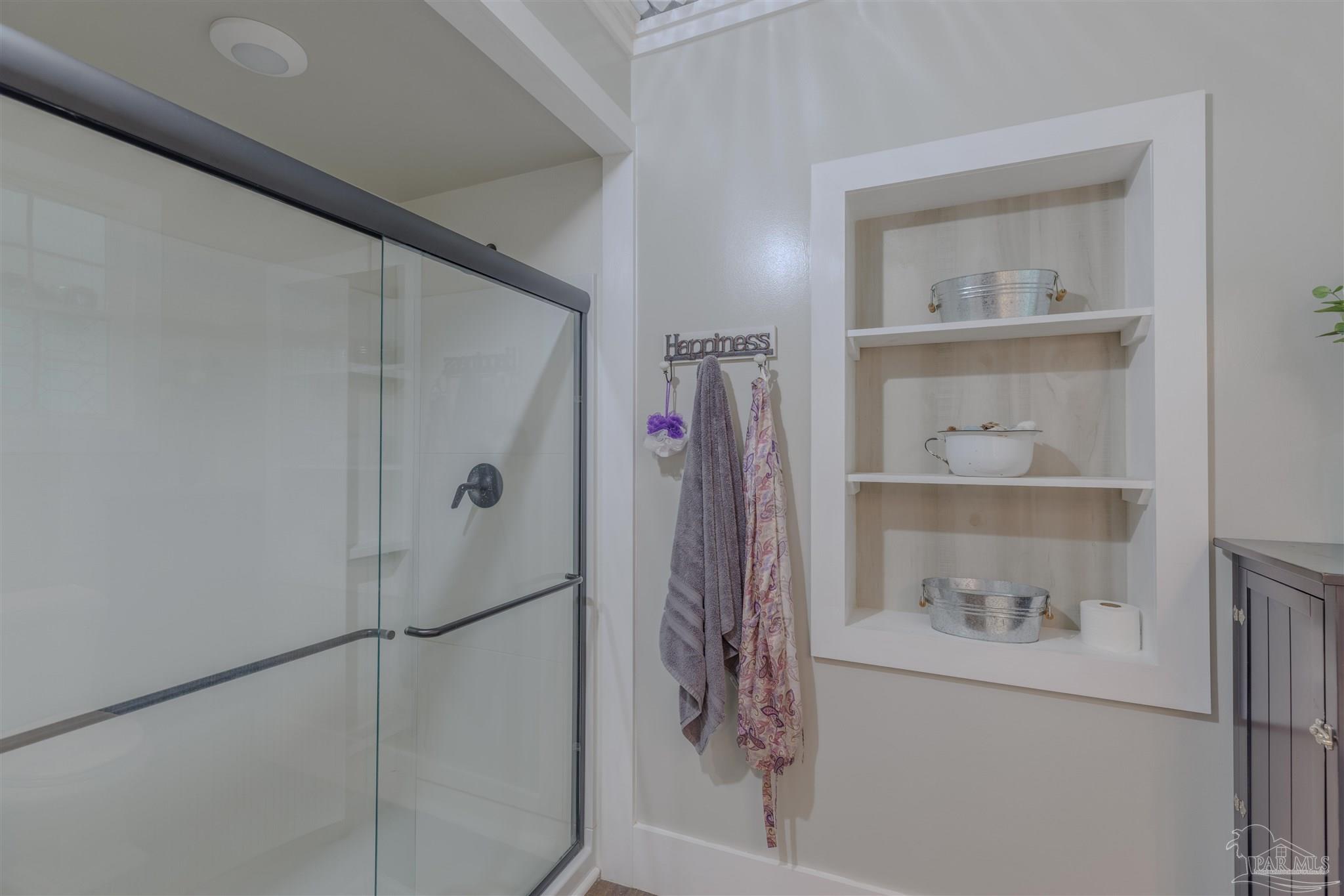 5049 Guernsey Road Pace, FL 32571 - Photo 40 of 61 a bathroom with a shower