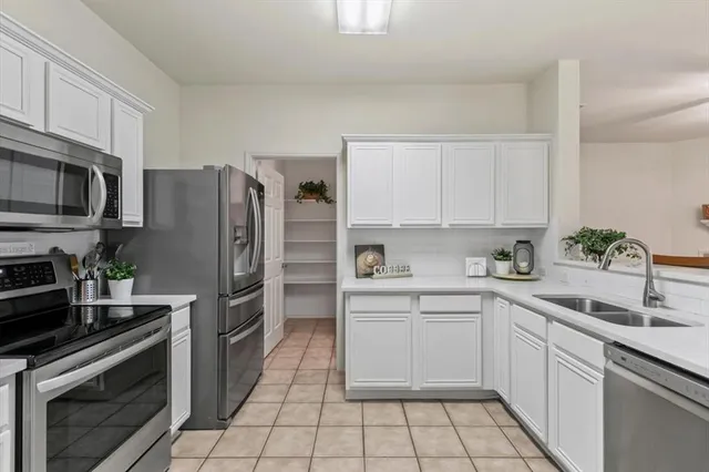 a kitchen with a stove and a microwave