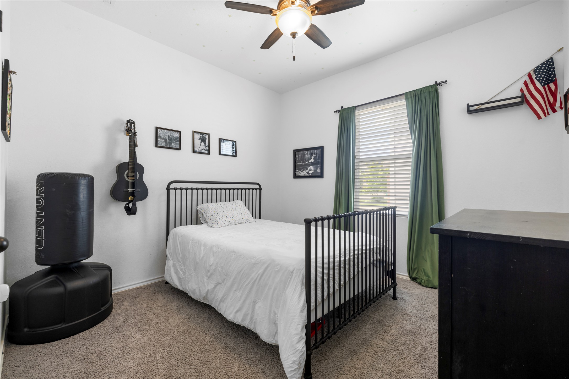 13113 Titanium Street Austin, TX 78754 - Photo 10 of 39 Secondary Bedroom featuring window for natural light, a ceiling fan and closet.
