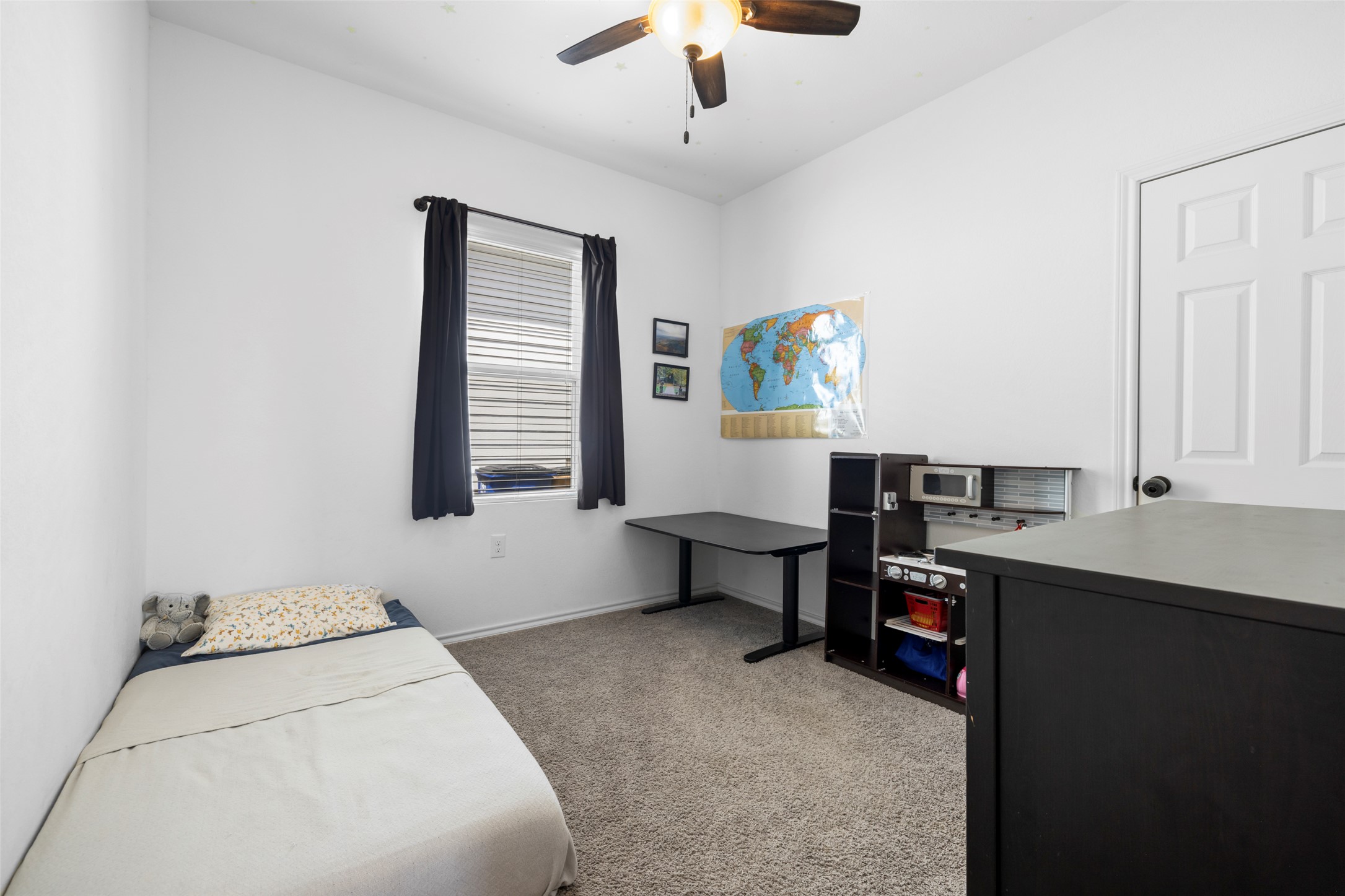 13113 Titanium Street Austin, TX 78754 - Photo 13 of 39 Secondary Bedroom also features a window for natural light, a ceiling fan and a closet.