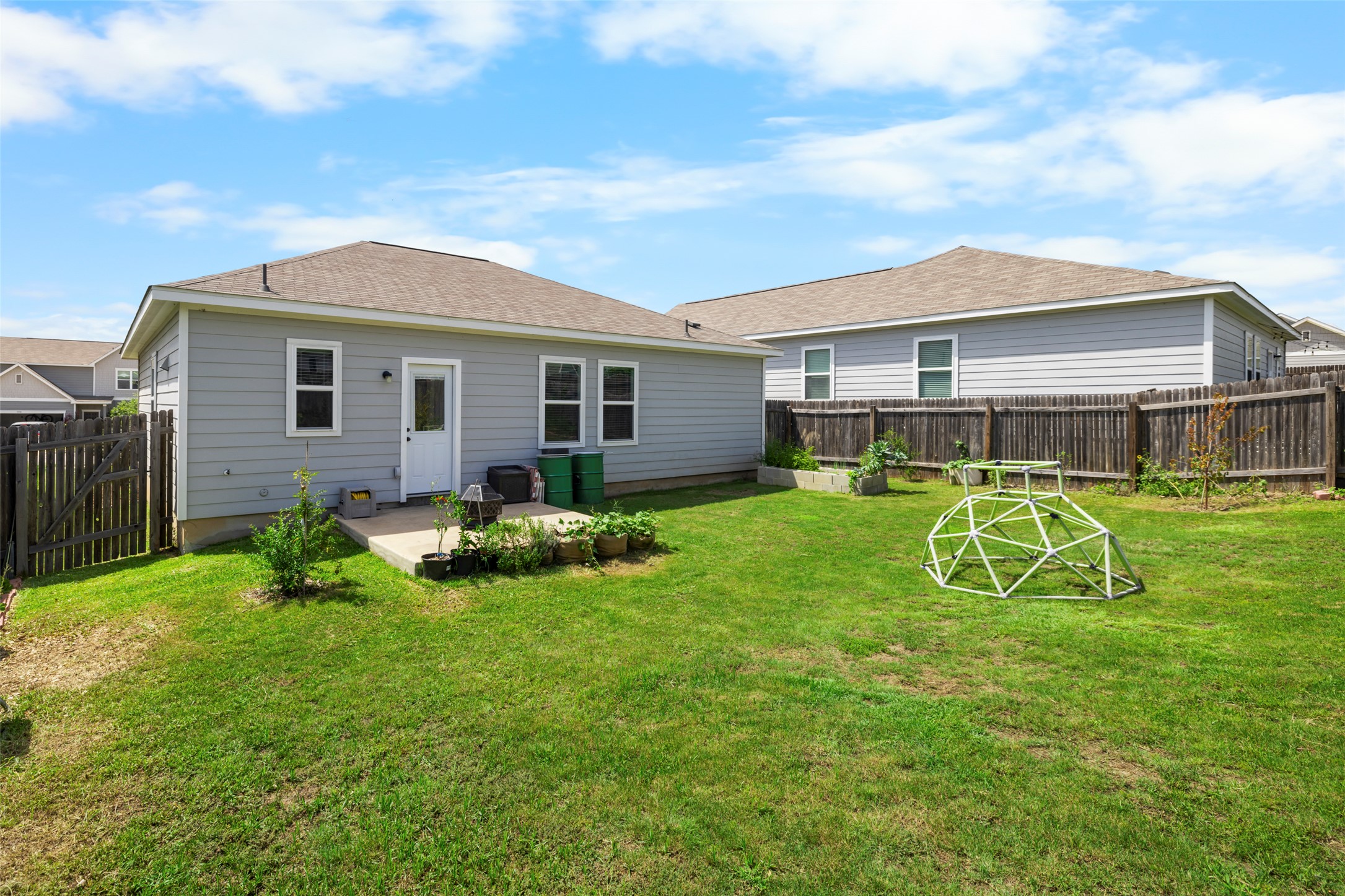 13113 Titanium Street Austin, TX 78754 - Photo 23 of 39 Two rain barrels full of rain water for the garden!