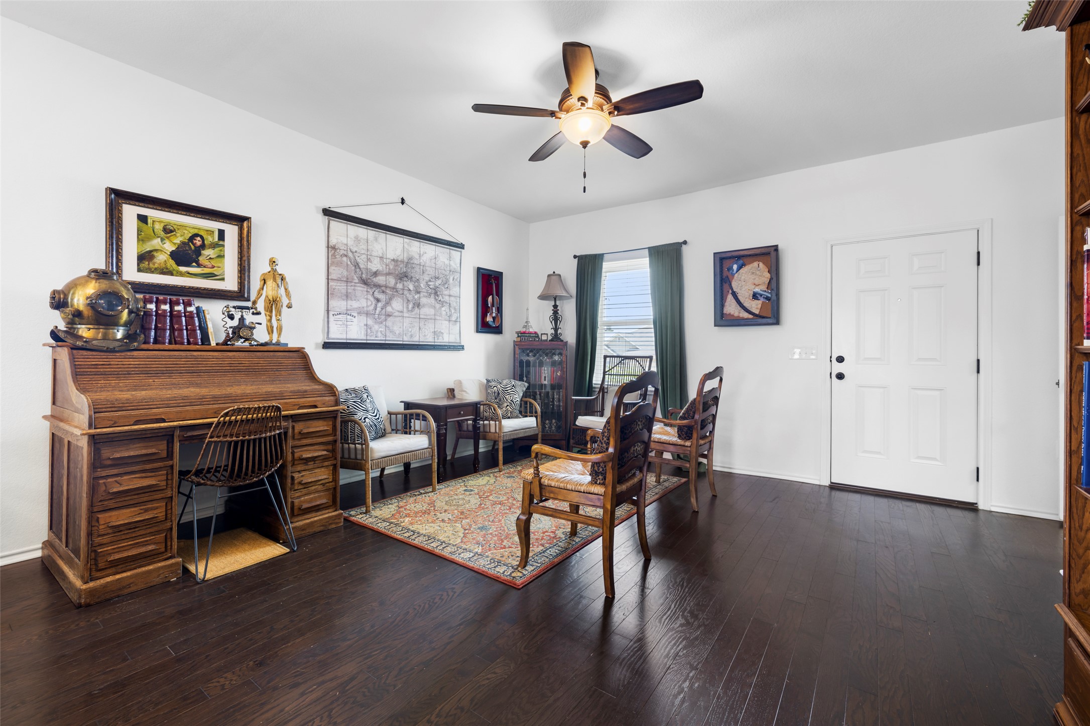 13113 Titanium Street Austin, TX 78754 - Photo 5 of 39 Living area with engineered wood flooring and ceiling fan.