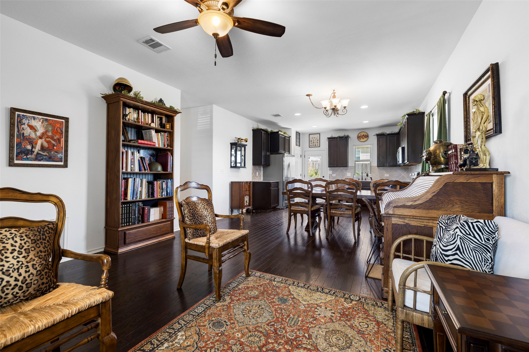 13113 Titanium Street Austin, TX 78754 - Photo 6 of 39 Dining area featuring engineered wood floors, and a chandelier