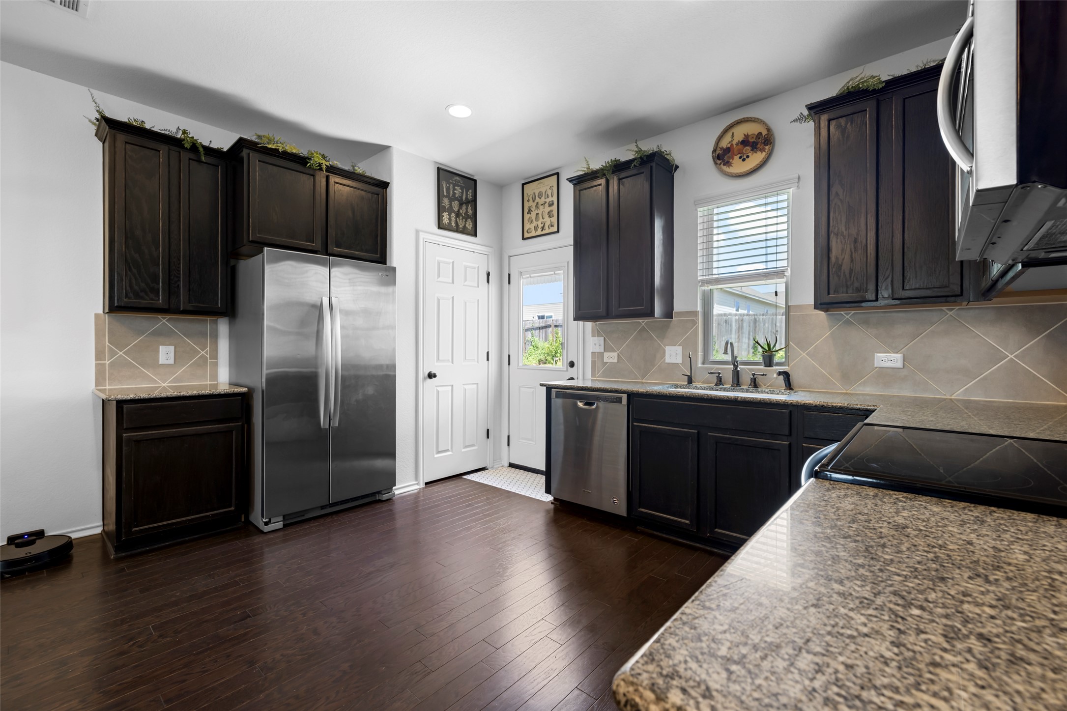 13113 Titanium Street Austin, TX 78754 - Photo 8 of 39 Penny tile at the back door for easy clean up from the back garden