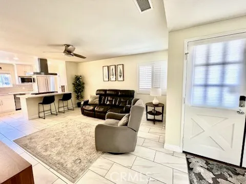a kitchen with a stove a sink and a refrigerator