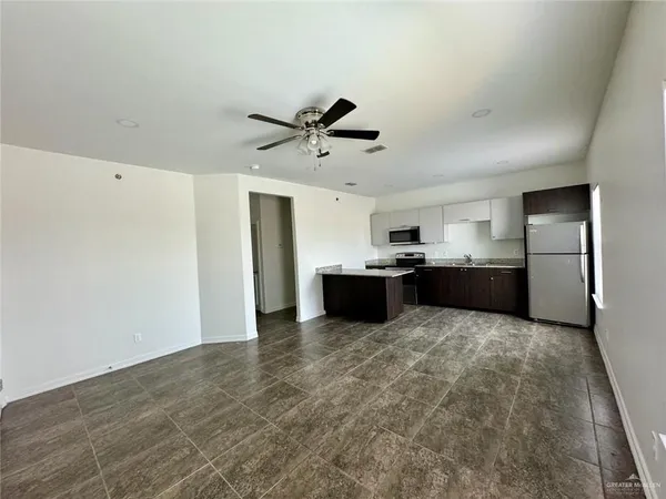 a view of kitchen with wooden floor