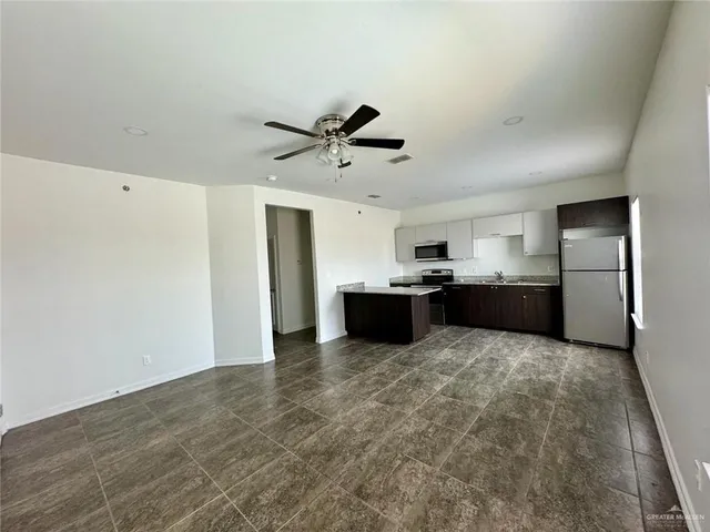 a view of kitchen with wooden floor