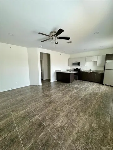 a large bathroom with a tub sink and a mirror