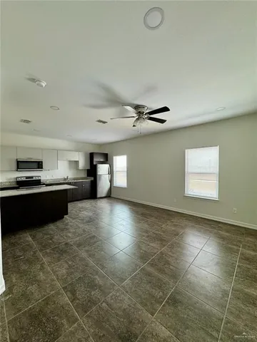 a view of kitchen with cabinets