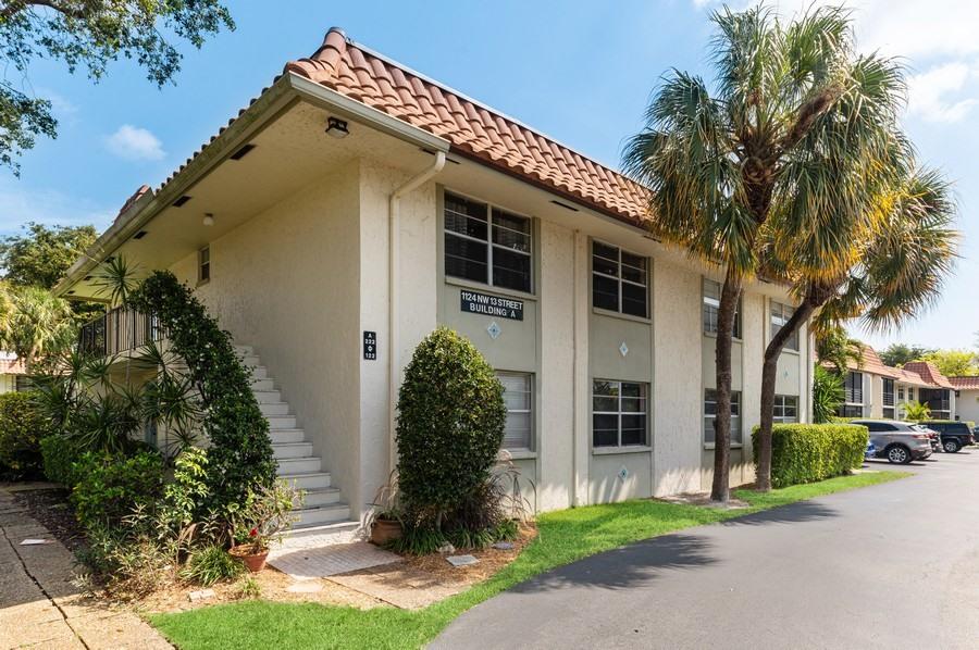 1124 Northwest 13th Street, Unit 114A Boca Raton, FL 33486 - Photo 1 of 15 01_1124-NW-13th-St_114A_57_Front-View_We