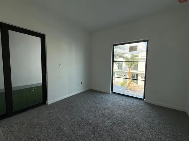 a bathroom with a toilet sink and shower