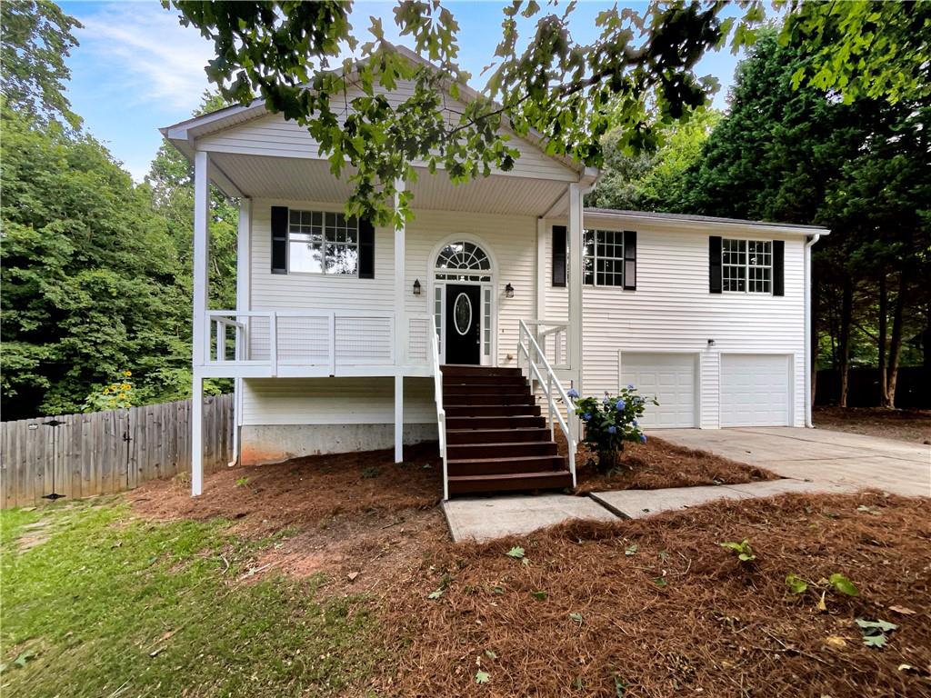 497 Cedar Ridge Drive Winder, GA 30680 - Photo 1 of 1 a front view of a house with a yard