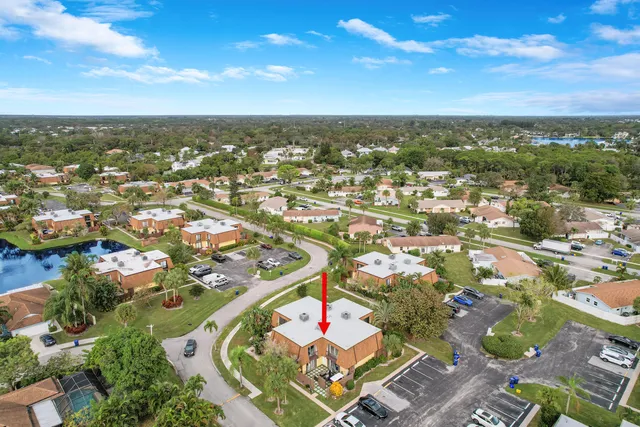 an aerial view of residential houses with city view