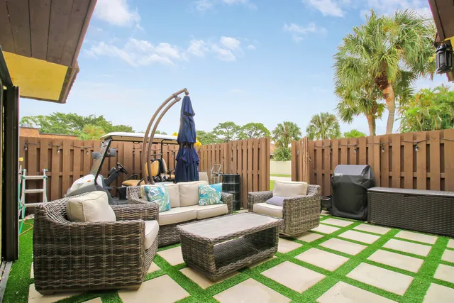 a view of outdoor sitting area with furniture and wooden deck