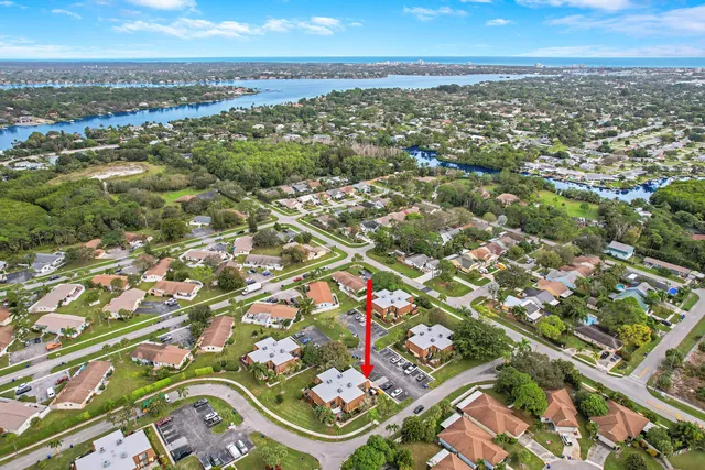 an aerial view of residential building with yard