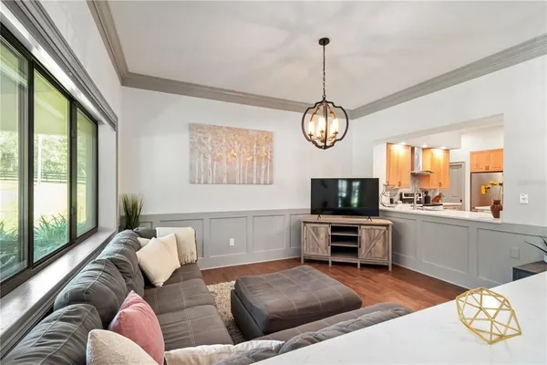 a front view of a house with yard and trees