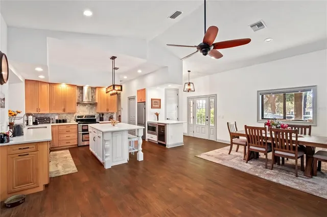 a view of a livingroom with wooden floor and a window