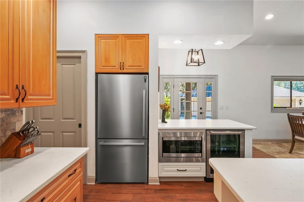 8820 Northwest 130th Street Reddick, FL 32686 - Photo 17 of 67 a kitchen with stainless steel appliances a refrigerator and a stove top oven