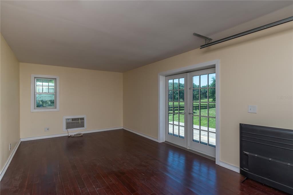 8820 Northwest 130th Street Reddick, FL 32686 - Photo 33 of 67 a view of a livingroom with wooden floor and a window