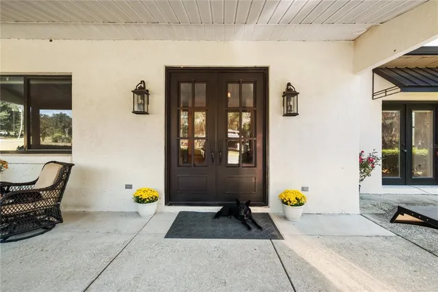 a large bathroom with double vanity and a large mirror
