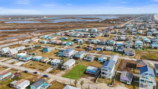 an aerial view of a house with a garden and sitting area