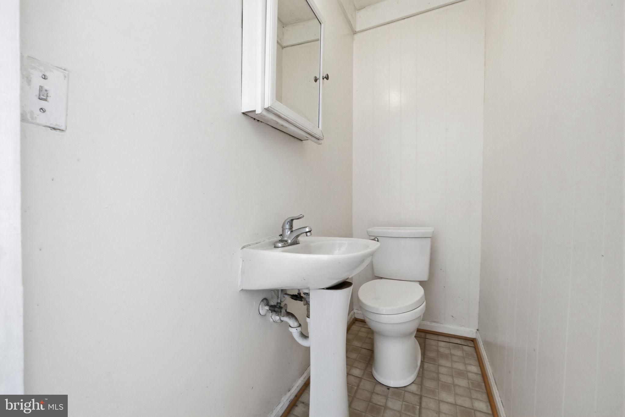 3449 Old Frederick Road Baltimore, MD 21229 - Photo 18 of 25 Bright and functional half-bath space.