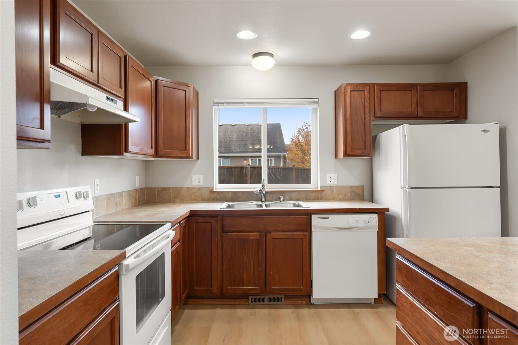 116 Goldmyer Drive Chehalis, WA 98532 - Photo 11 of 38 a kitchen with a sink a stove and refrigerator
