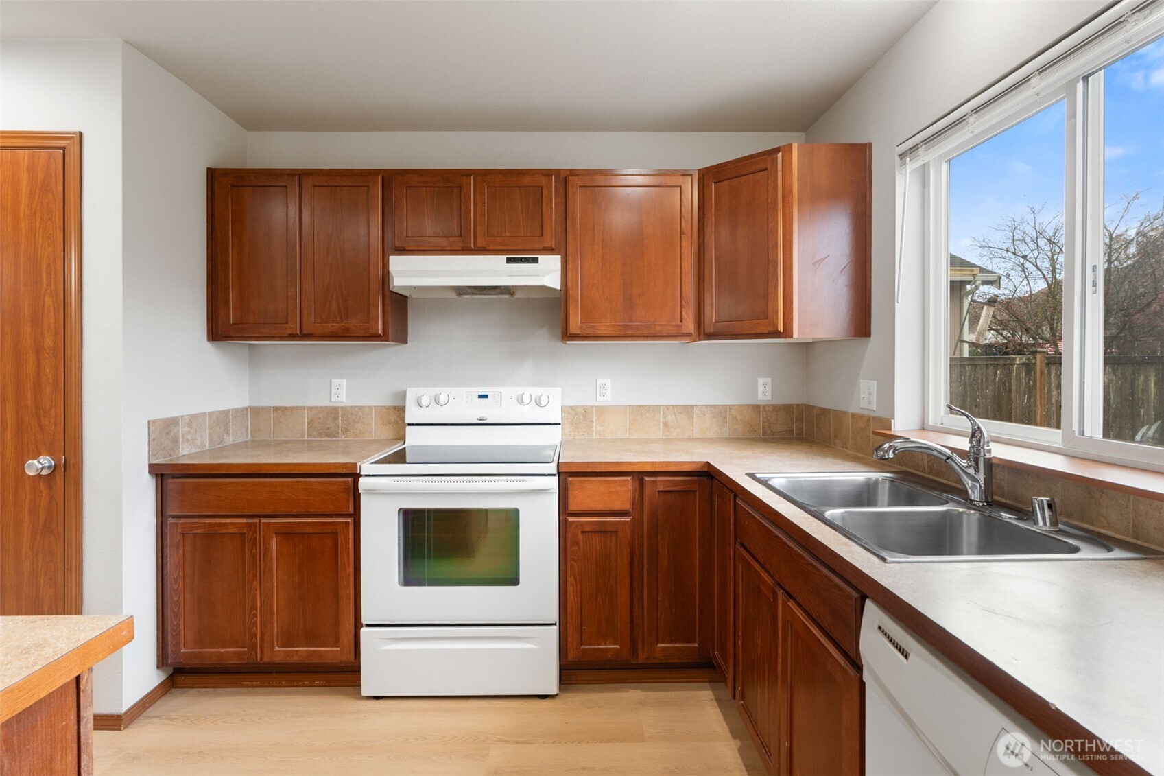 116 Goldmyer Drive Chehalis, WA 98532 - Photo 12 of 38 a kitchen with a sink stove and cabinets
