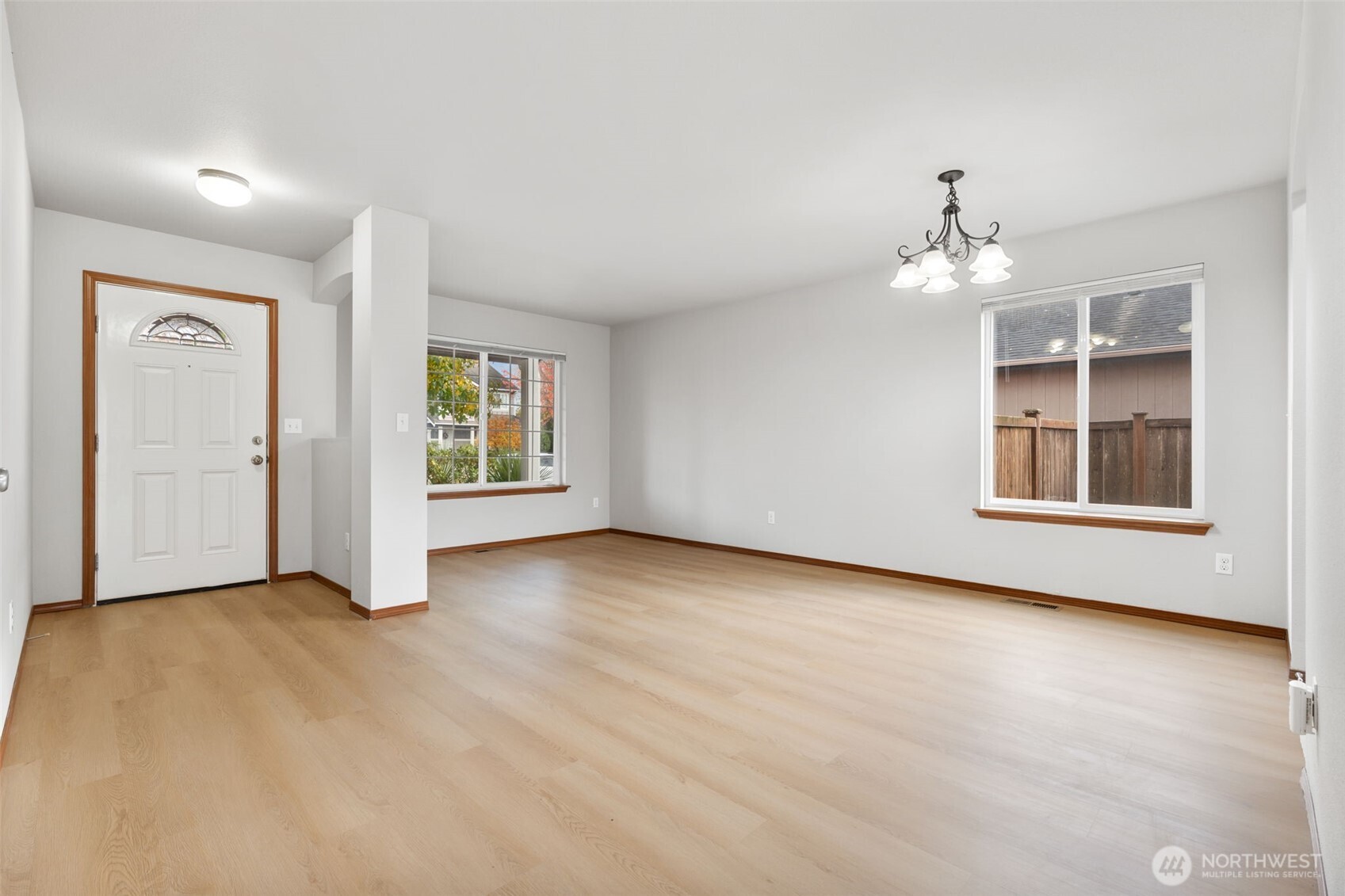 116 Goldmyer Drive Chehalis, WA 98532 - Photo 6 of 38 an empty room with windows and chandelier