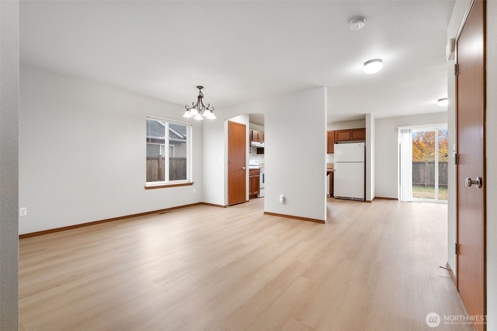 116 Goldmyer Drive Chehalis, WA 98532 - Photo 7 of 38 an empty room with wooden floor and windows