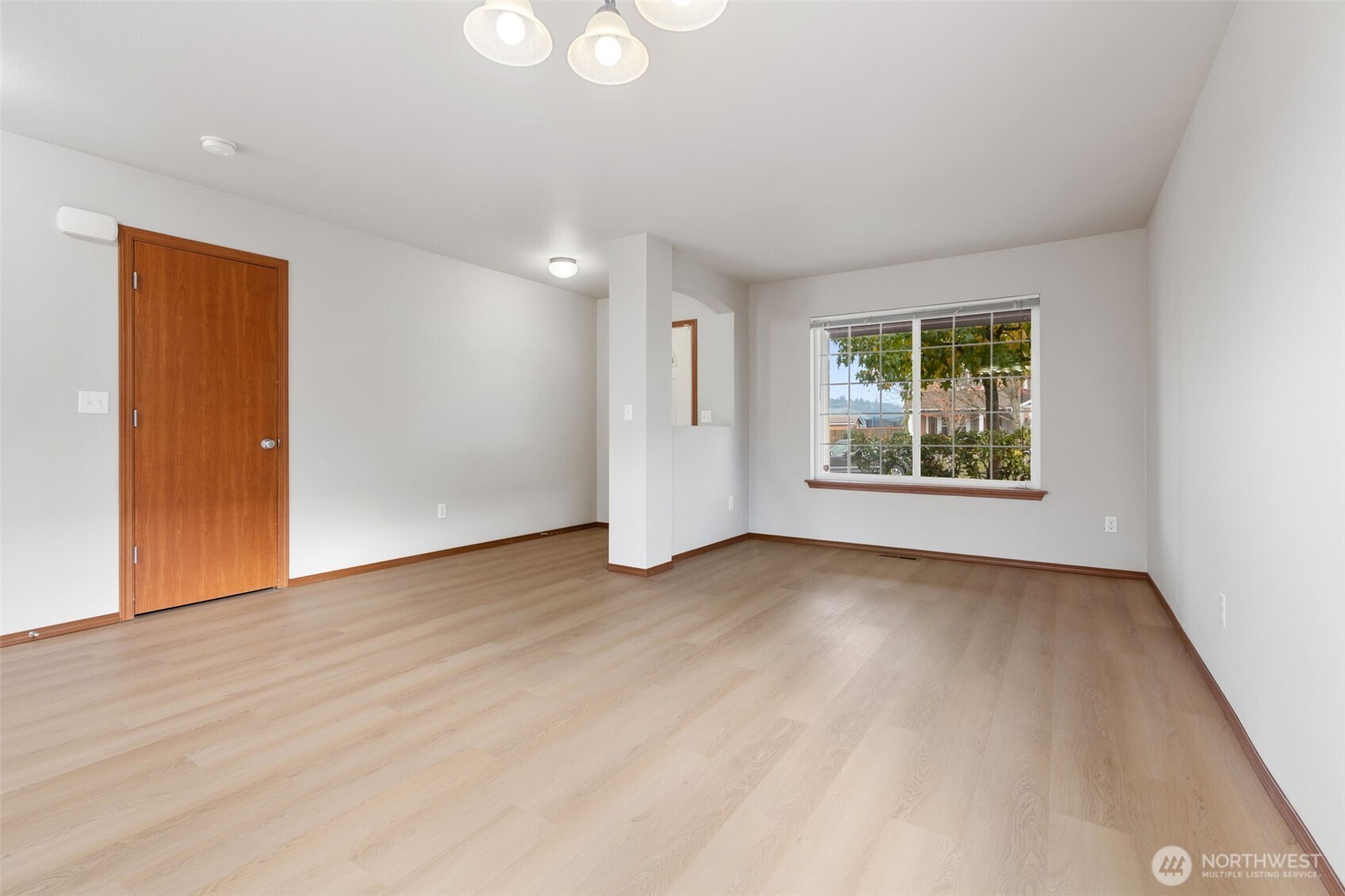 116 Goldmyer Drive Chehalis, WA 98532 - Photo 9 of 38 an empty room with wooden floor and windows