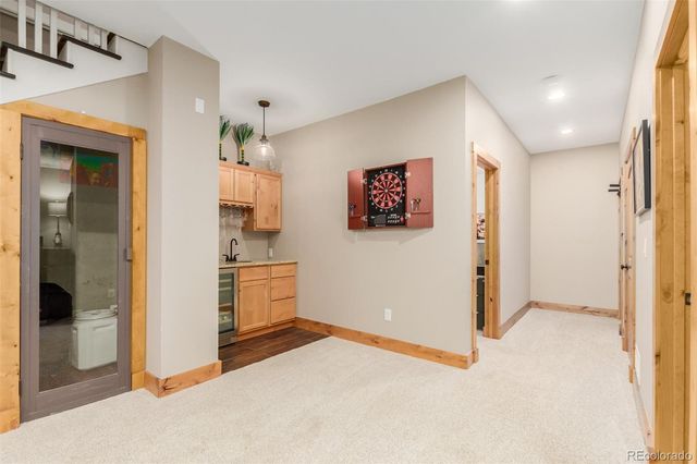 a view of a kitchen with refrigerator and cabinet
