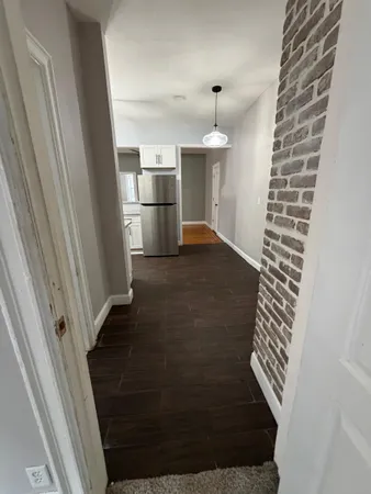 a view of empty room with a fireplace