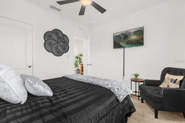 a bedroom with a bed and furniture