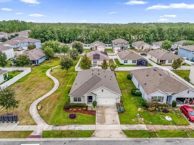 an aerial view of a house with a garden