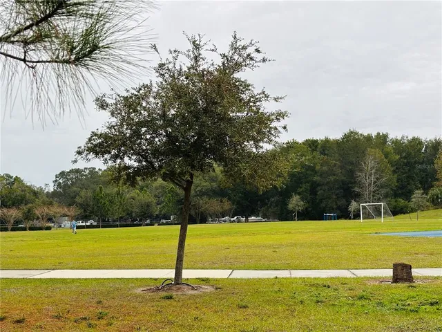 a view of a swimming pool with an outdoor space and seating area