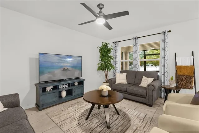 a living room with furniture and a flat screen tv
