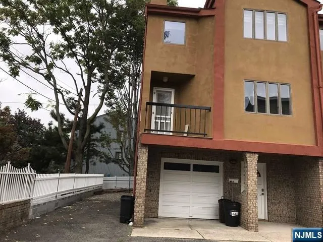 a front view of a house with a garage