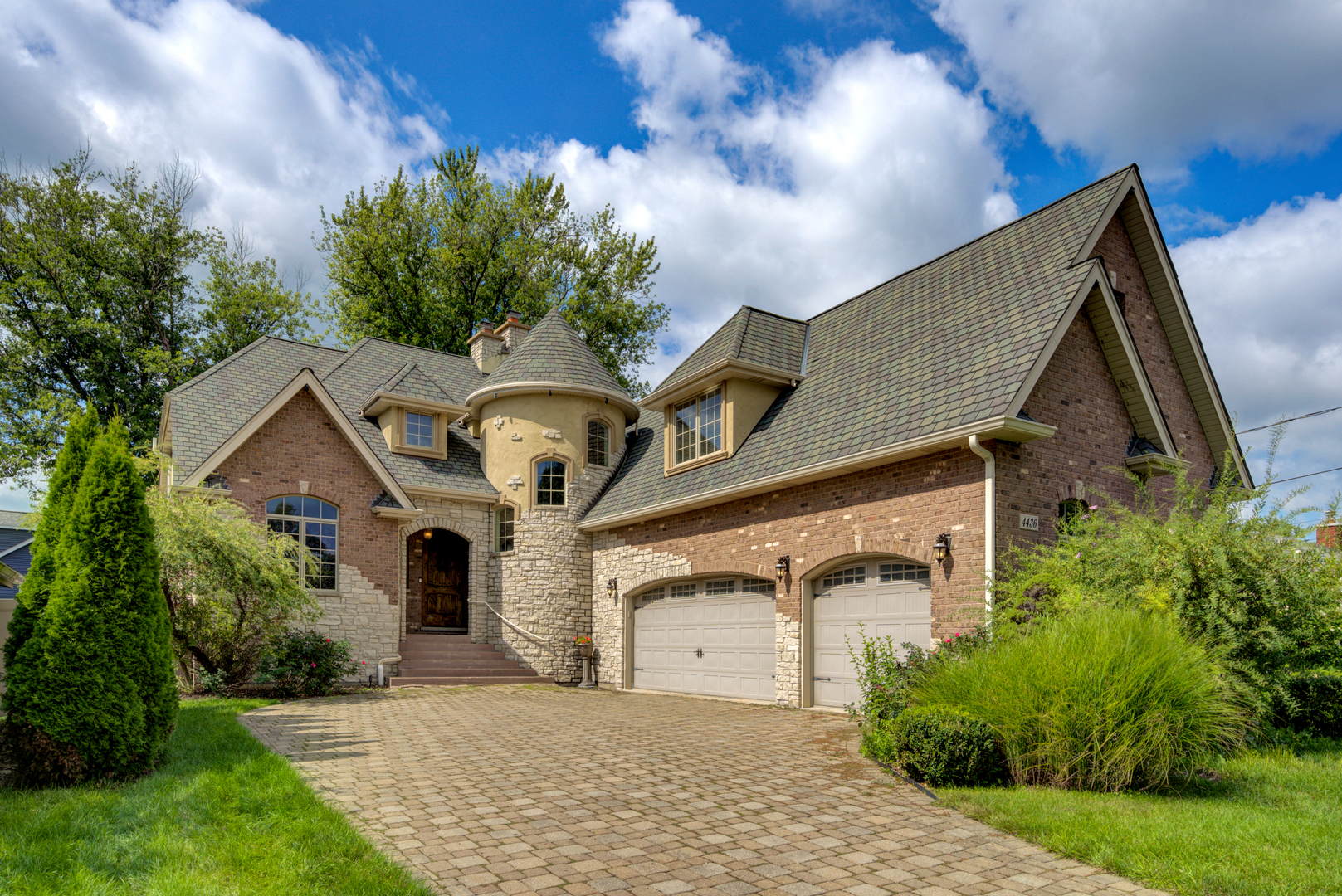 4436 Roslyn Road Downers Grove, IL 60515 - Photo 1 of 30 a front view of a house with a garden