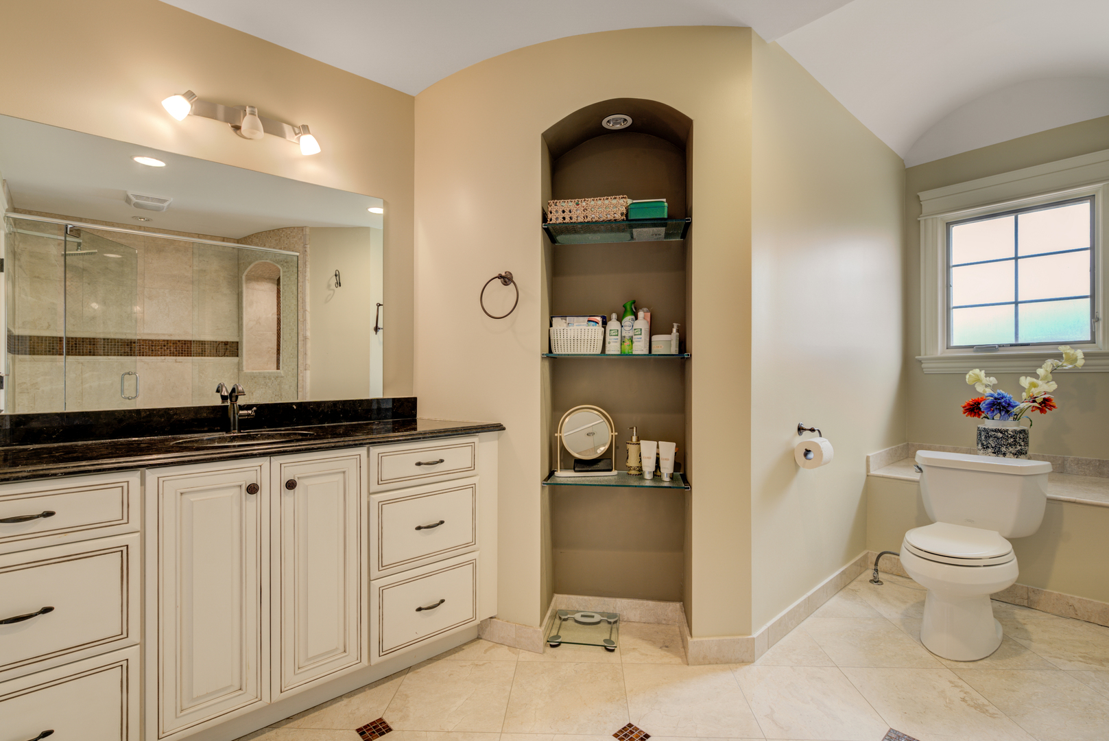 4436 Roslyn Road Downers Grove, IL 60515 - Photo 16 of 30 a spacious bathroom with a granite countertop sink toilet and a mirror