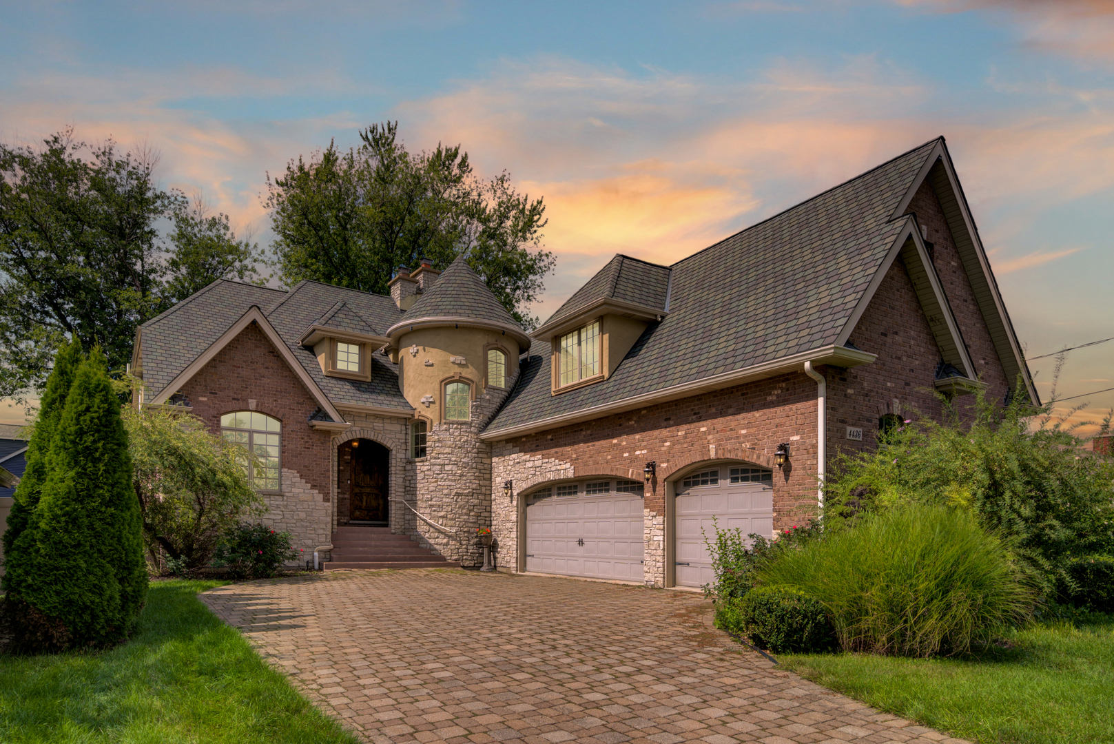 4436 Roslyn Road Downers Grove, IL 60515 - Photo 27 of 30 a front view of a house with a yard and garage