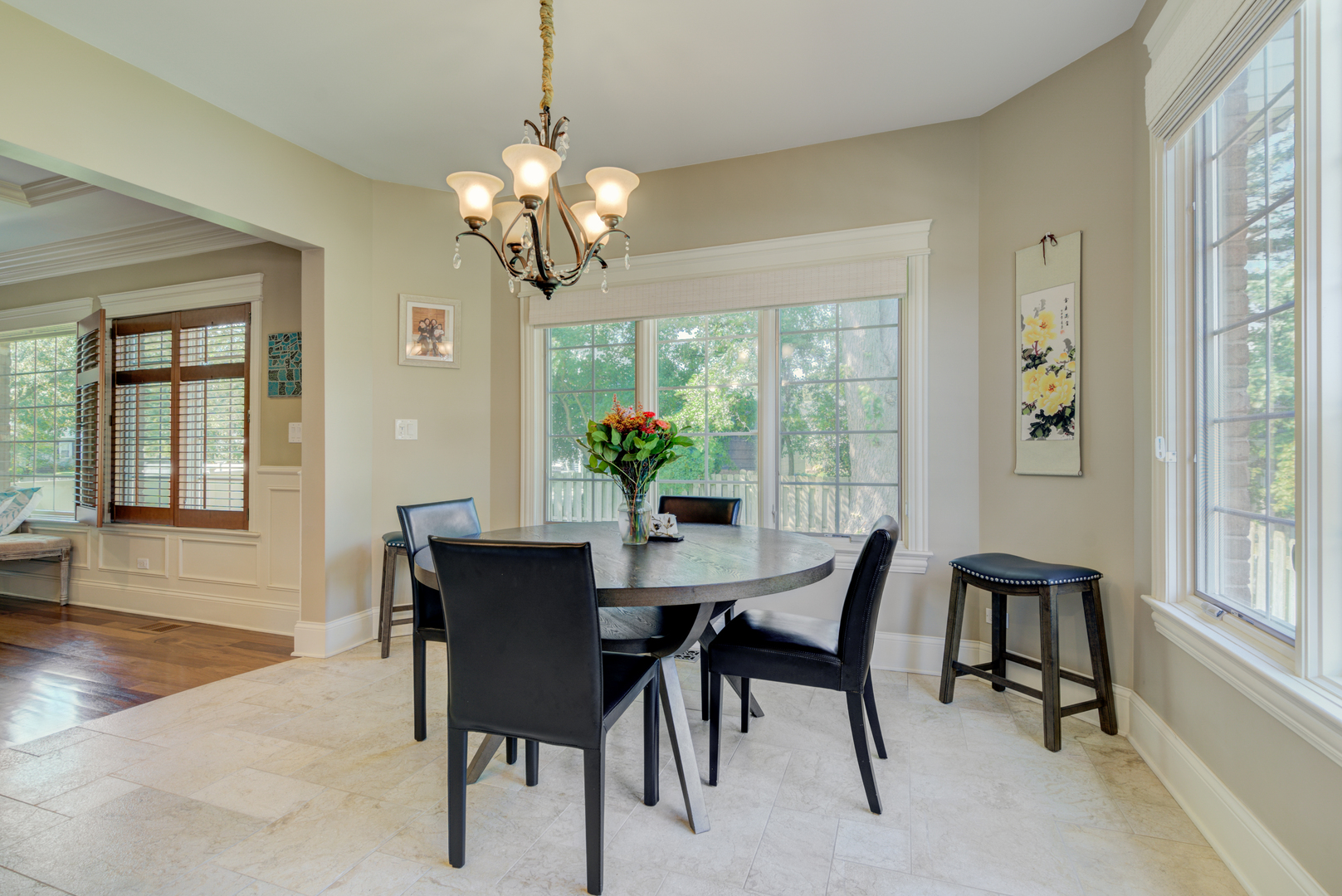 4436 Roslyn Road Downers Grove, IL 60515 - Photo 9 of 30 a view of a dining room with furniture a chandelier and wooden floor