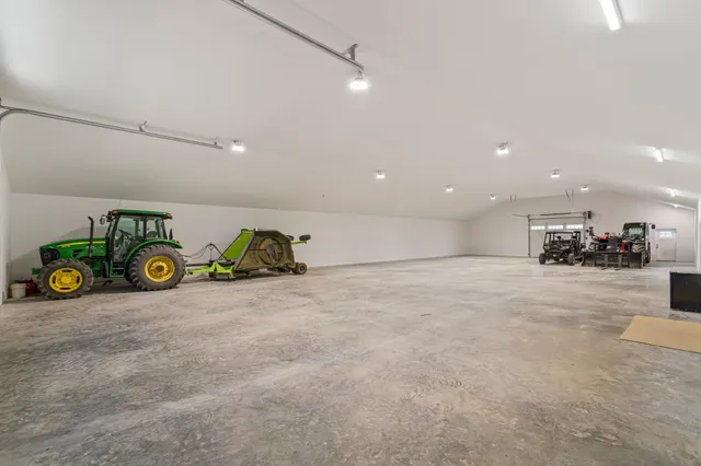a view of a lush green hillside and houses